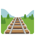 A train track with trees in the background